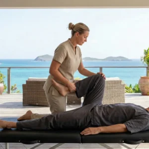European therapist performing Thai table massage on luxury villa terrace Saint Martin SXM