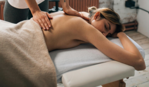 Therapist performing a personalized intuitive massage focused on energy balancing at Uhaina Home massage in Saint Martin SXM.