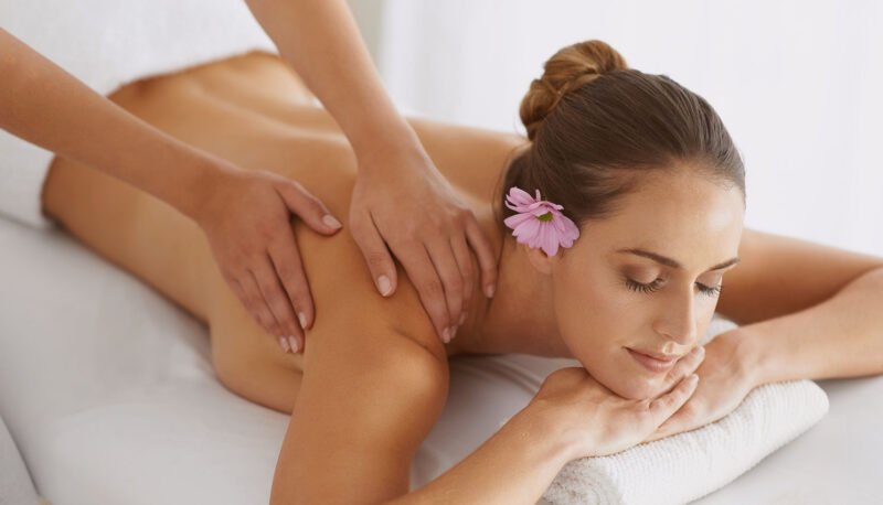 Professional therapist performing a relaxing Swedish Flow massage at a luxury spa in Saint Martin SXM.